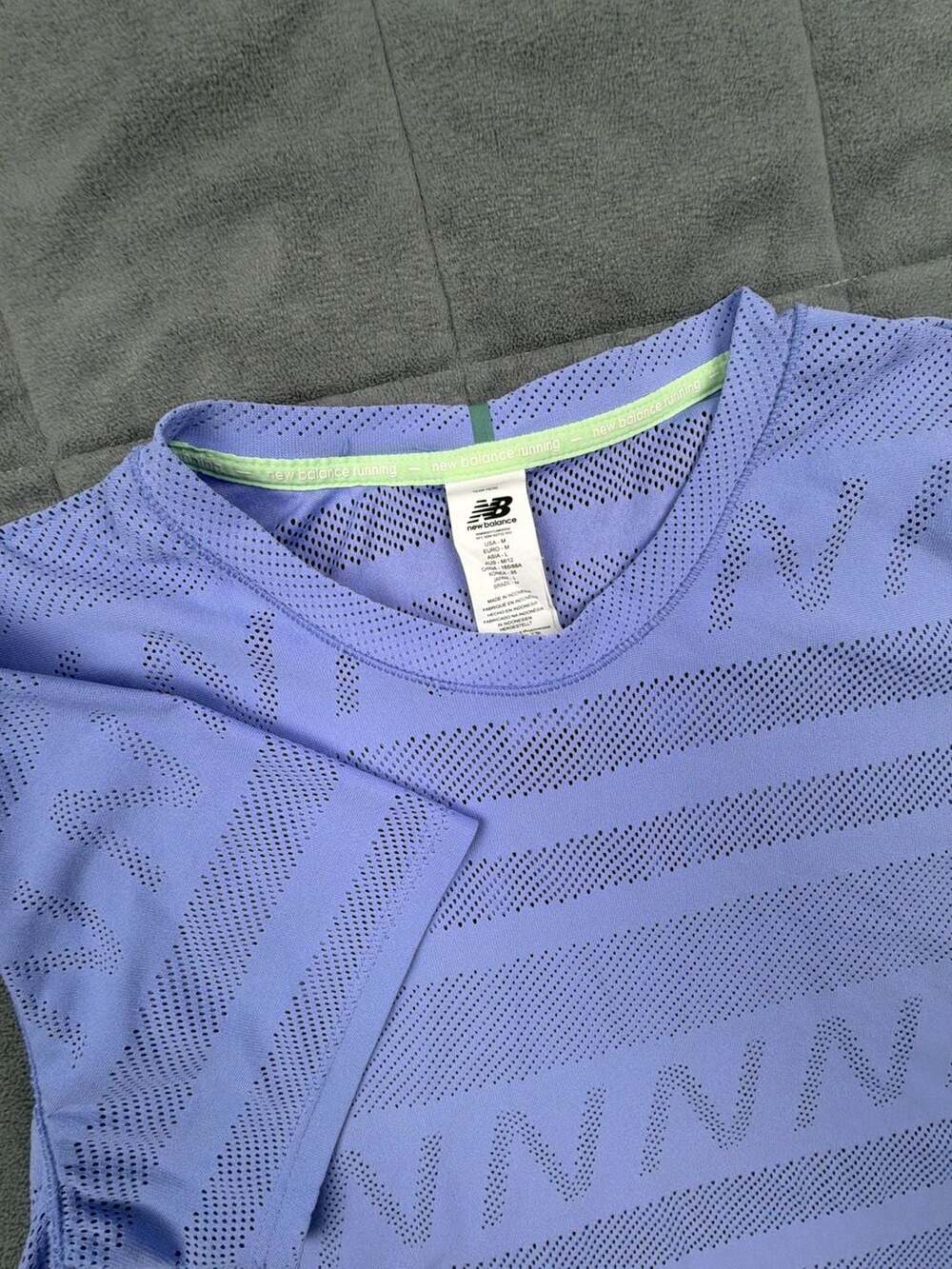New Balance women’s Running Performance Laser-Cut Mesh Short Sleeve Top